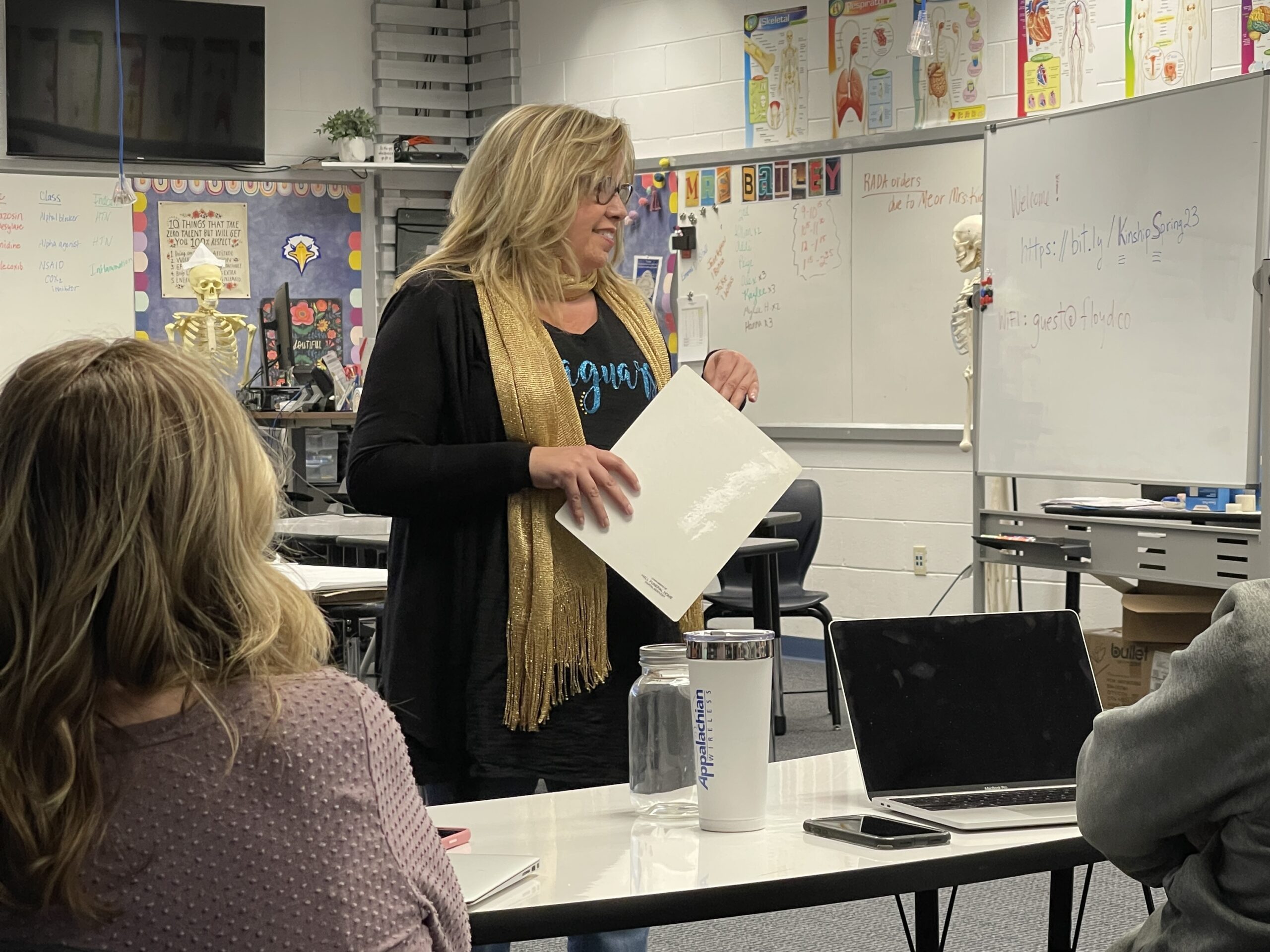 Mary Slone presenting in front of a crowd