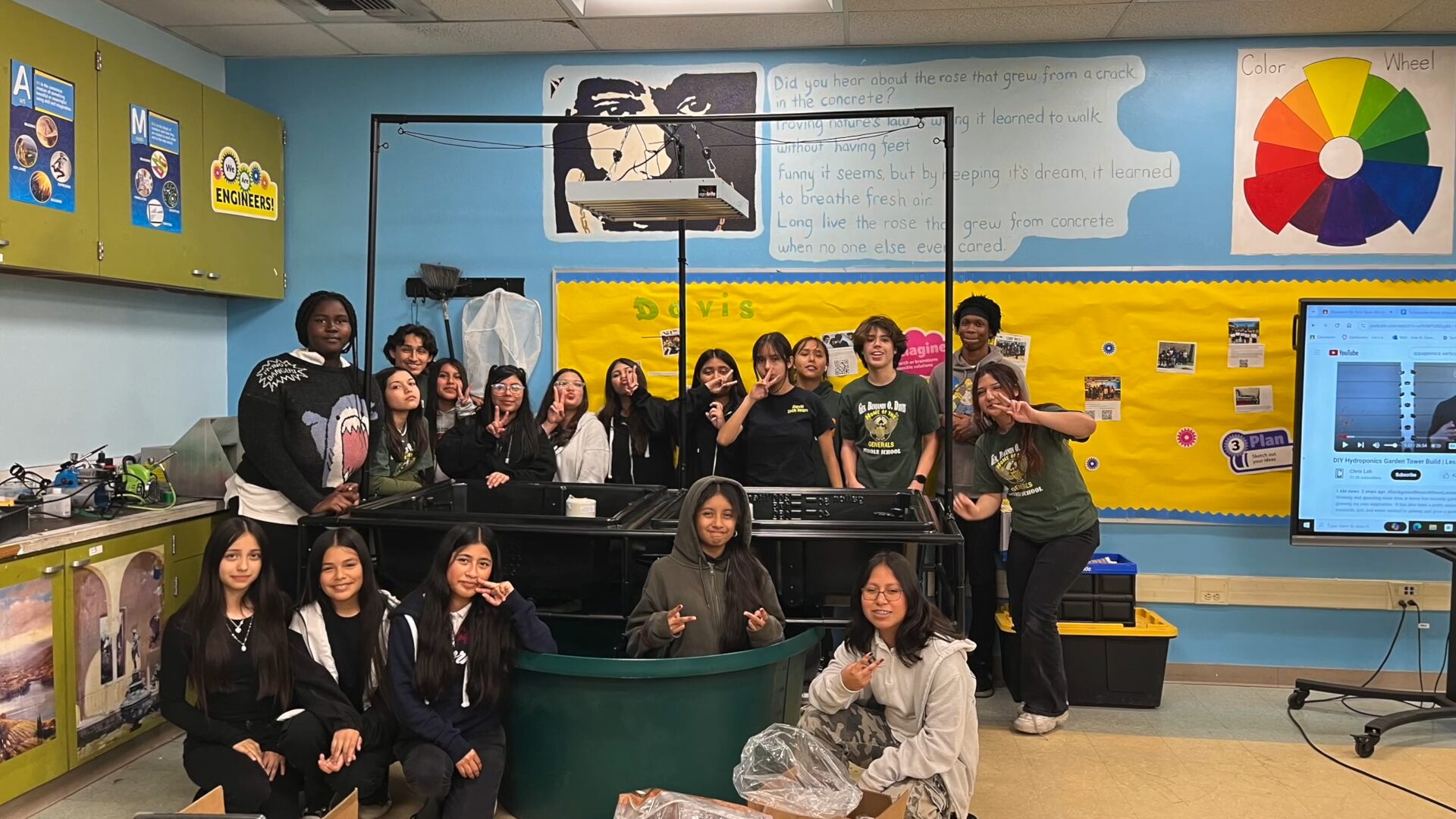 Students pose with their aquaponics system.